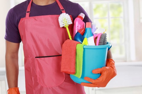 Cleaner removing dust and construction residue in a W11 property after renovation