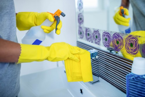 Local technician cleaning fabric furniture in West London
